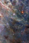 Тайны и чудеса паучьей туманности: взгляд Hubble на звёздные колыбели Большого Магелланова Облака
